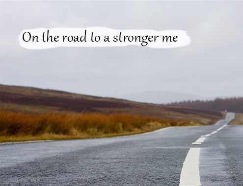 Picture of an empty road, captioned On the road to a stronger me